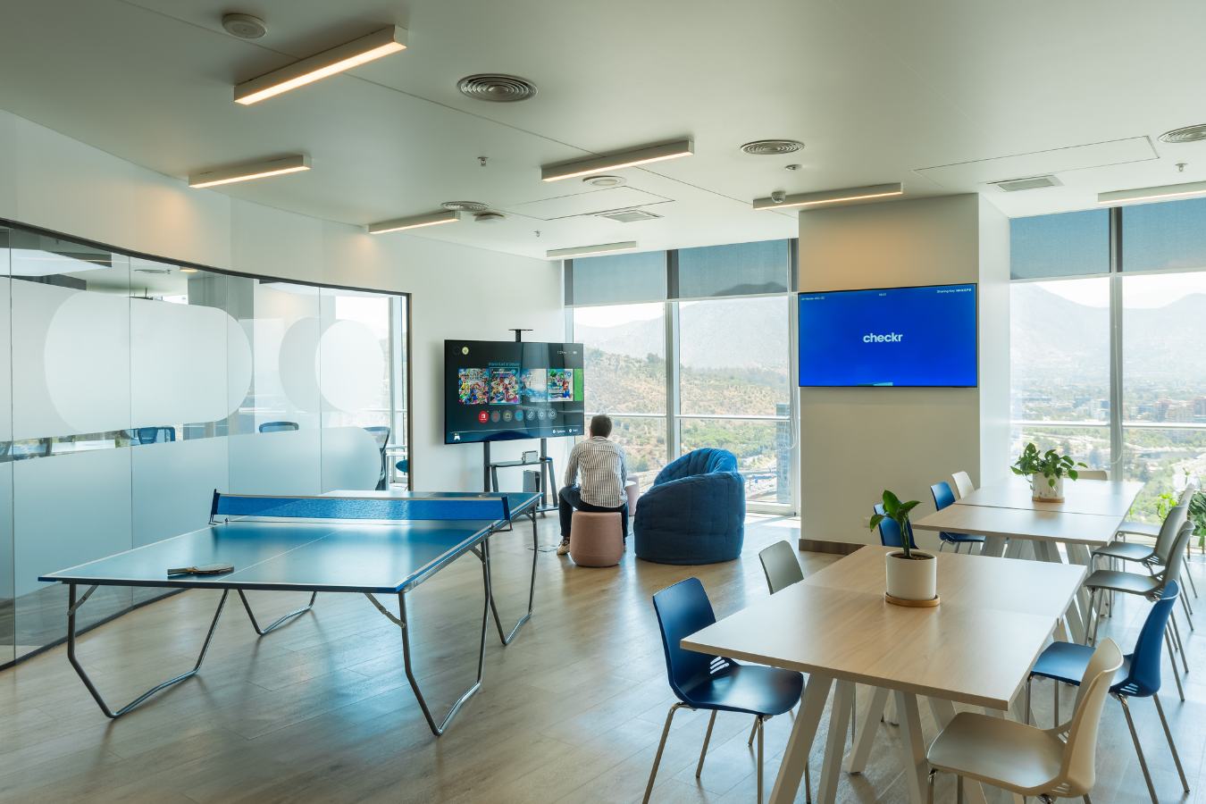Checkr Offices - Employee recreation zone featuring a ping pong table and panoramic city views - Contract Workplaces.jpg